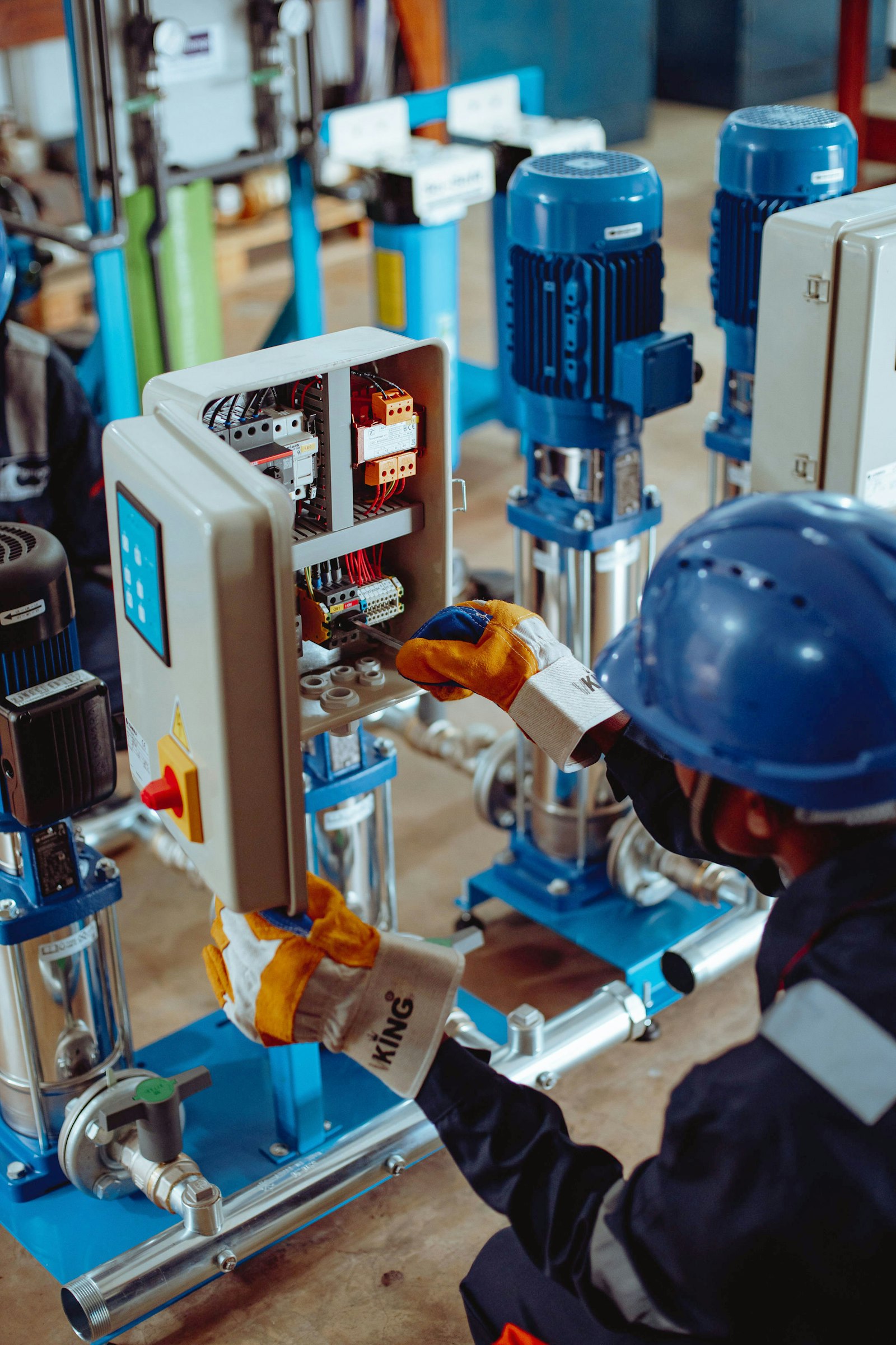 Technician performing predictive maintenance on industrial equipment